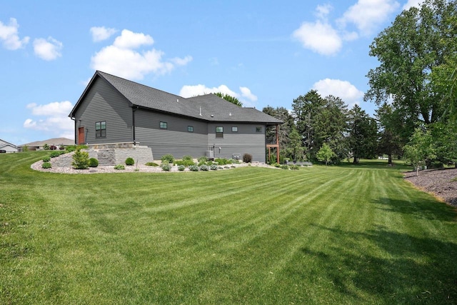 6612 Florance Ruth Ln, Sun Prairie, WI 53590 - view of side of home featuring a yard and stone siding