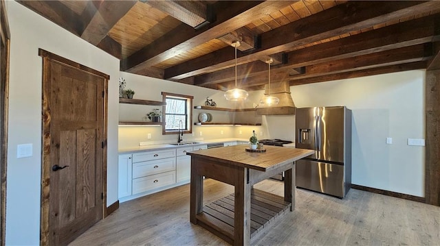 11960 US Highway 63, Hayward, WI 54843 - kitchen featuring a sink, light wood-style flooring, stainless steel fridge, and open shelves