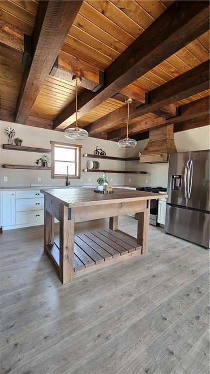 11960 US Highway 63, Hayward, WI 54843 - kitchen with light wood-style flooring, open shelves, appliances with stainless steel finishes, and wooden ceiling