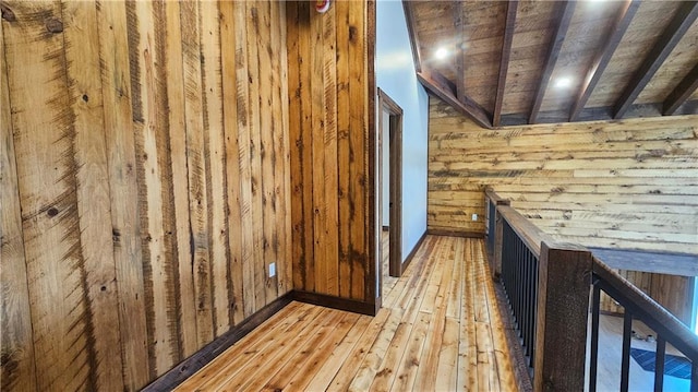 11960 US Highway 63, Hayward, WI 54843 - interior space with light wood-type flooring, wooden walls, wood ceiling, and beamed ceiling