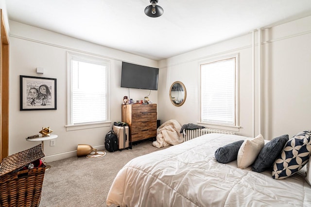 carpeted bedroom with baseboards
