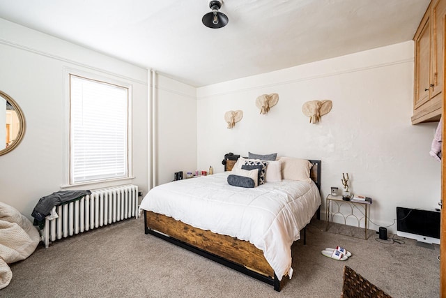 carpeted bedroom featuring radiator
