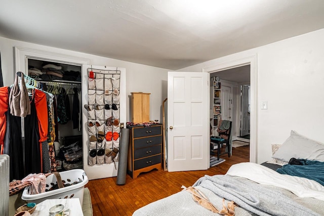 bedroom with a closet and wood finished floors