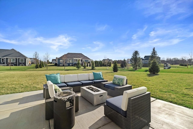 view of patio / terrace with an outdoor living space with a fire pit
