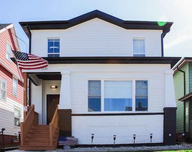 view of front of house with brick siding