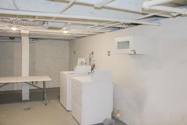 laundry room featuring laundry area and separate washer and dryer