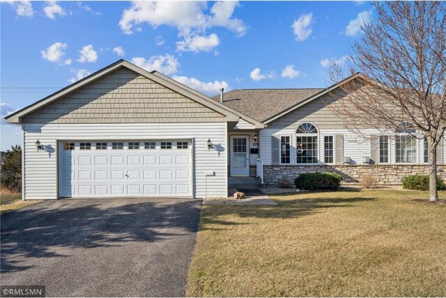 219 Bluff Dr, Somerset, WI 54025 - ranch-style house with an attached garage, driveway, a front yard, and stone siding