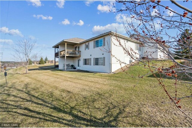 219 Bluff Dr, Somerset, WI 54025 - rear view of property with a patio, a balcony, and a lawn