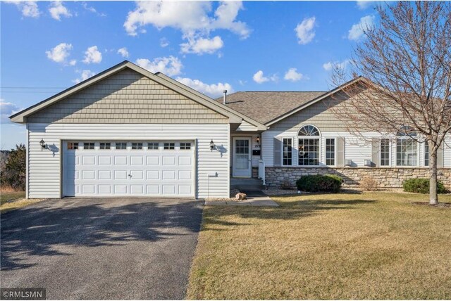 219 Bluff Dr, Somerset, WI 54025 - single story home with an attached garage, driveway, stone siding, and a front lawn