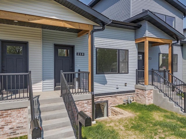 216 S Dewey Ave, Reedsburg, WI 53959 - view of exterior entry featuring covered porch