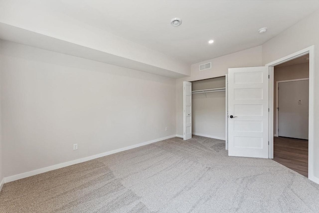 216 S Dewey Ave, Reedsburg, WI 53959 - unfurnished bedroom featuring carpet floors, baseboards, a closet, and recessed lighting
