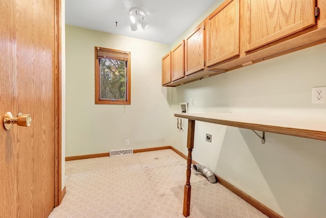 W8547 Cloverleaf Lake Rd, Clintonville, WI 54929 - laundry room featuring cabinet space, hookup for an electric dryer, washer hookup, light carpet, and baseboards