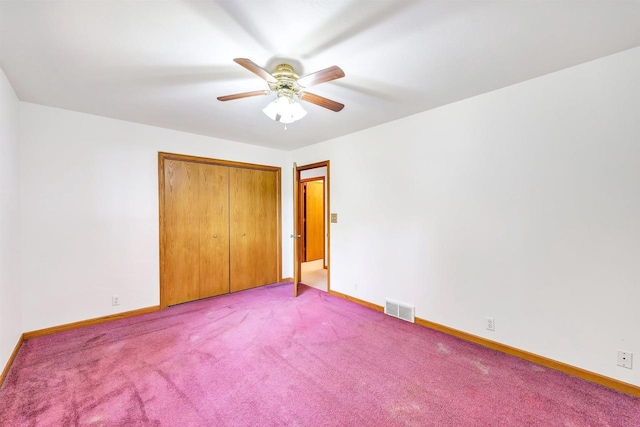 W8547 Cloverleaf Lake Rd, Clintonville, WI 54929 - unfurnished bedroom with light carpet, baseboards, a closet, and a ceiling fan