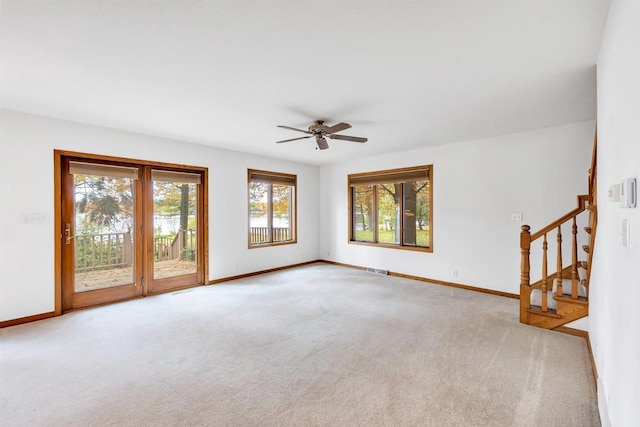 W8547 Cloverleaf Lake Rd, Clintonville, WI 54929 - empty room featuring carpet flooring, stairway, baseboards, and a ceiling fan