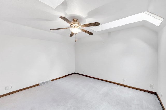 W8547 Cloverleaf Lake Rd, Clintonville, WI 54929 - empty room with a skylight, light carpet, baseboards, and ceiling fan