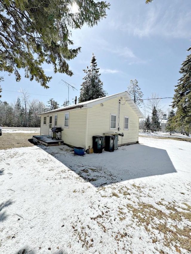 N8193 M35, Cedar River, MI 49887 - snow covered rear of property featuring a wooden deck