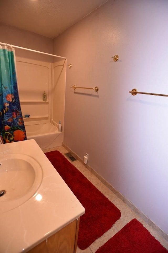W1514 Spirit Ridge Trl, Keshena, WI 54135 - full bathroom featuring vanity, shower / tub combo with curtain, tile patterned floors, and baseboards