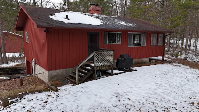 W1514 Spirit Ridge Trl, Keshena, WI 54135 - view of front of home with a chimney and a shingled roof