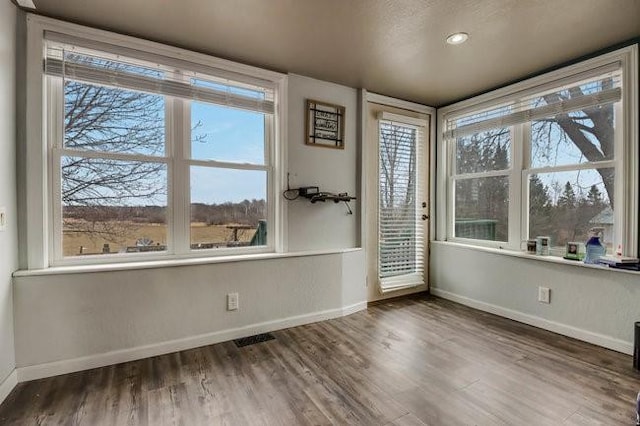 8283 345th St, Stanley, WI 54768 - interior space with plenty of natural light, visible vents, baseboards, and wood finished floors