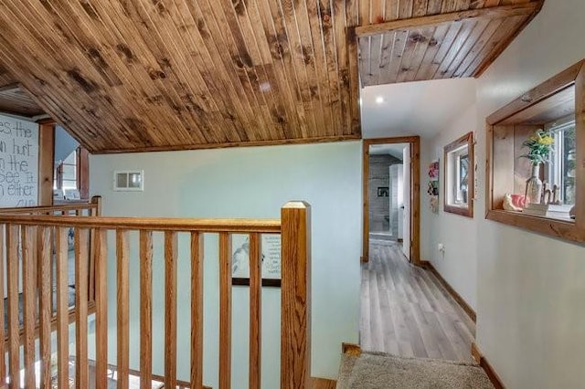 8283 345th St, Stanley, WI 54768 - hallway with wooden ceiling, baseboards, visible vents, and a wealth of natural light