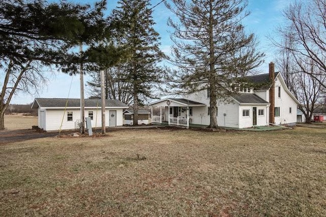 8283 345th St, Stanley, WI 54768 - rear view of house with a lawn