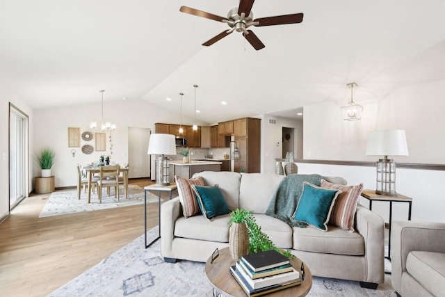 6101 Fox Run Ln, Mount Pleasant, WI 53406 - living area with light wood-style flooring, ceiling fan with notable chandelier, lofted ceiling, and recessed lighting
