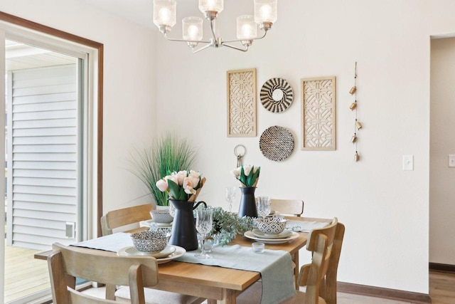 6101 Fox Run Ln, Mount Pleasant, WI 53406 - dining room with baseboards, a chandelier, and wood finished floors