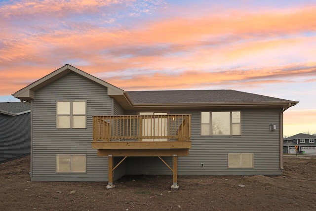 6101 Fox Run Ln, Mount Pleasant, WI 53406 - back of property with a shingled roof and a wooden deck