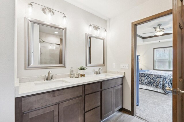 6101 Fox Run Ln, Mount Pleasant, WI 53406 - ensuite bathroom featuring double vanity, a tile shower, a sink, and connected bathroom