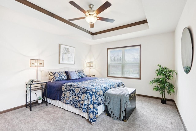 6101 Fox Run Ln, Mount Pleasant, WI 53406 - carpeted bedroom with baseboards, a raised ceiling, and ceiling fan
