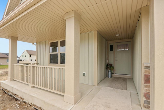 6101 Fox Run Ln, Mount Pleasant, WI 53406 - doorway to property featuring board and batten siding and covered porch