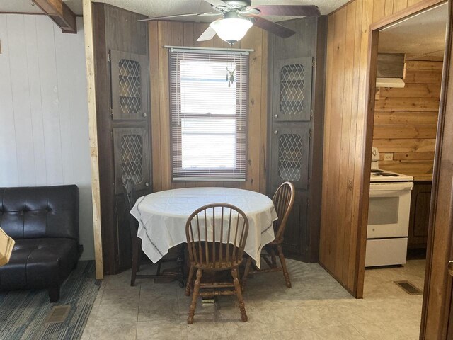 2123 French St, Friendship, WI 53934 - dining area with wood walls, ceiling fan, and visible vents