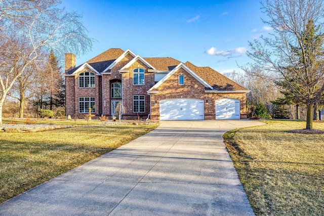 N4455 Dorothy Jane Ct, Kaukauna, WI 54130 - traditional home featuring brick siding, a front yard, a chimney, and concrete driveway