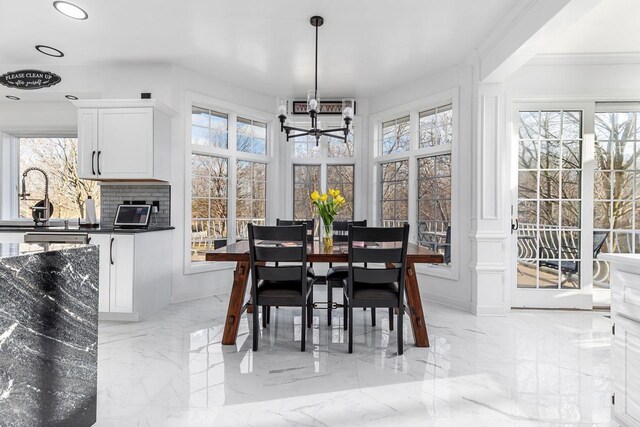 N4455 Dorothy Jane Ct, Kaukauna, WI 54130 - dining area with a chandelier, marble finish floor, plenty of natural light, and recessed lighting