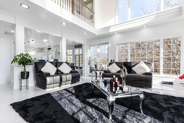N4455 Dorothy Jane Ct, Kaukauna, WI 54130 - living room with a towering ceiling, baseboards, recessed lighting, decorative columns, and marble finish floor