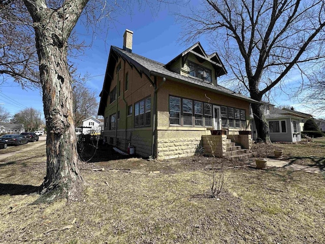 exterior space featuring a chimney