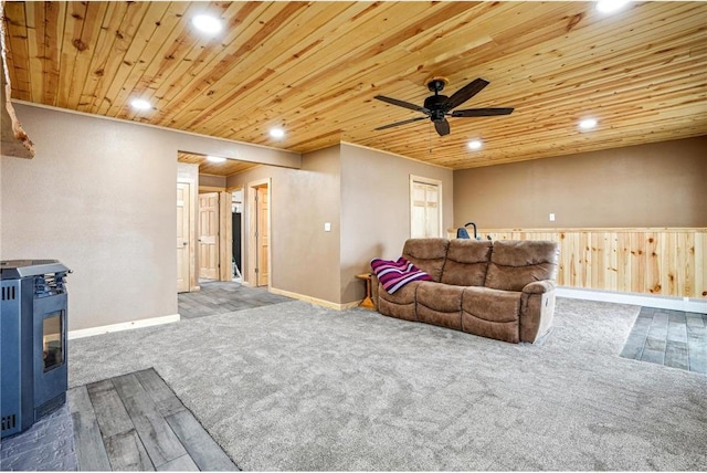 1794 W White Ash Dr, Balsam Lake, WI 54810 - carpeted living area with a wood stove, wooden ceiling, recessed lighting, ceiling fan, and baseboards