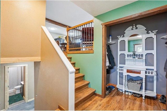 1794 W White Ash Dr, Balsam Lake, WI 54810 - stairs featuring wood finished floors and baseboards