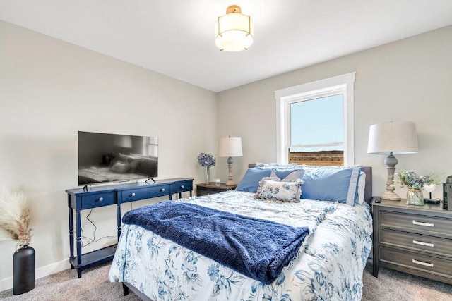 bedroom with carpet and baseboards