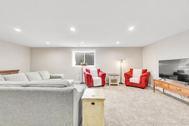 carpeted living room with recessed lighting and baseboards
