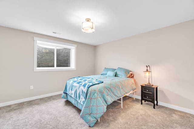 bedroom featuring carpet, visible vents, and baseboards
