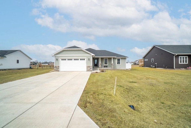 ranch-style house with concrete driveway, a front yard, stone siding, and a garage