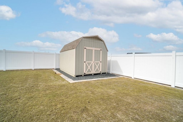 view of shed with a fenced backyard