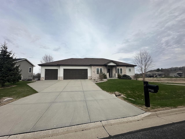 prairie-style house featuring stone siding, concrete driveway, a front yard, and a garage