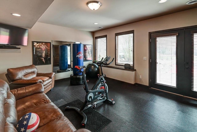 workout room featuring a wealth of natural light, visible vents, and recessed lighting