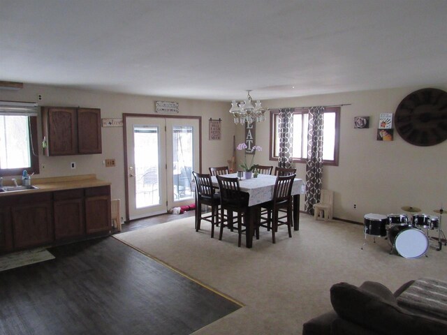 3012 16th St, Menominee, MI 49858 - dining area with an inviting chandelier and a healthy amount of sunlight