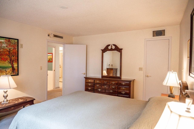 bedroom featuring visible vents