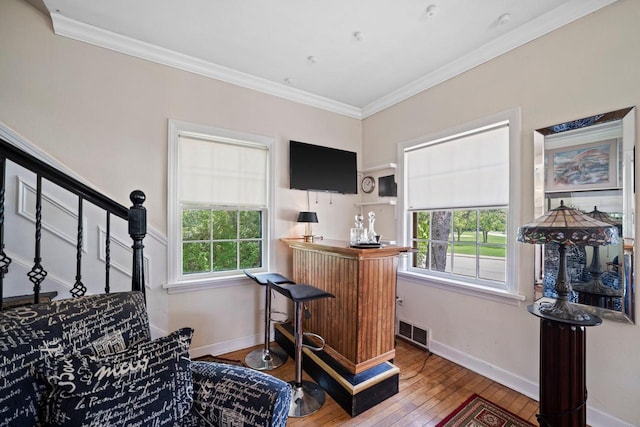 1941 S 124th St, New Berlin, WI 53151 - bar featuring visible vents, baseboards, ornamental molding, hardwood / wood-style flooring, and stairway