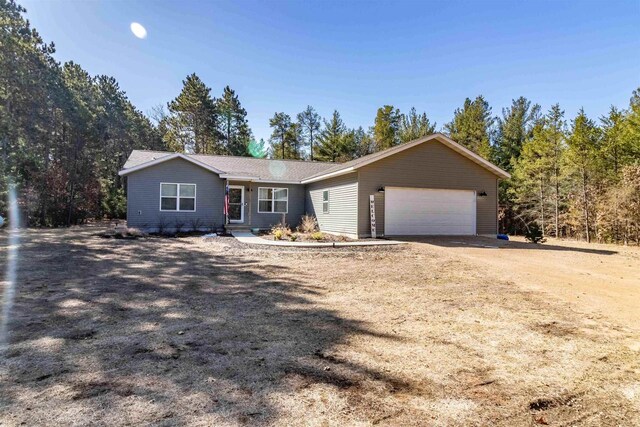 1851 Duck Creek Dr, Friendship, WI 53934 - ranch-style home featuring an attached garage and dirt driveway