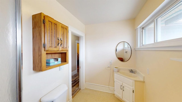 bathroom with toilet and vanity